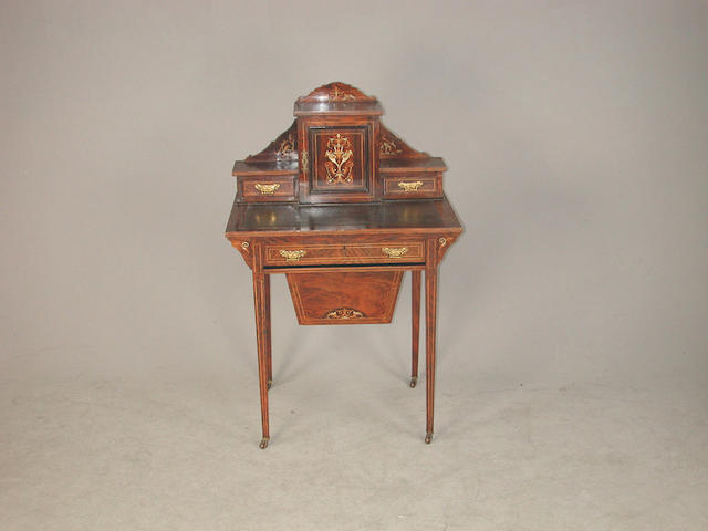 An Edwardian rosewood and inlaid desk and work table, the super structure with central cupboard door flanked by two short drawers,....