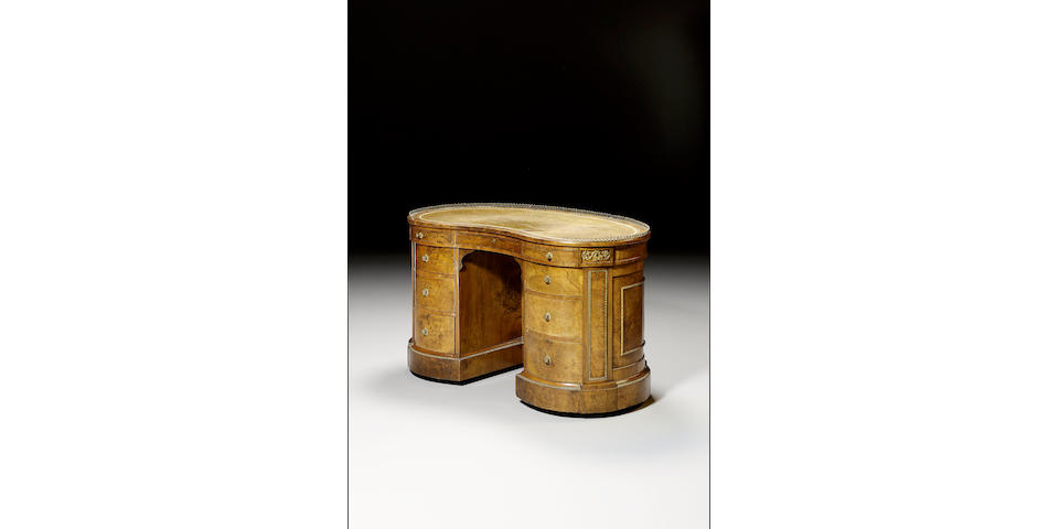 A fine Victorian burr walnut kidney shaped pedestal Desk, applied with gilt metal mounts,