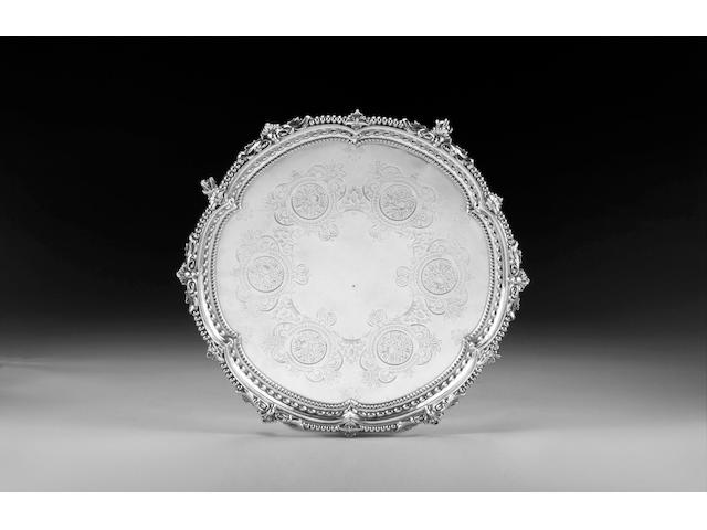A Victorian shaped circular silver salver, by Martin Hall & Co., Sheffield 1898, engraved with retail mark for Waterhouse Dublin, 42cm. diameter, weight 62oz.