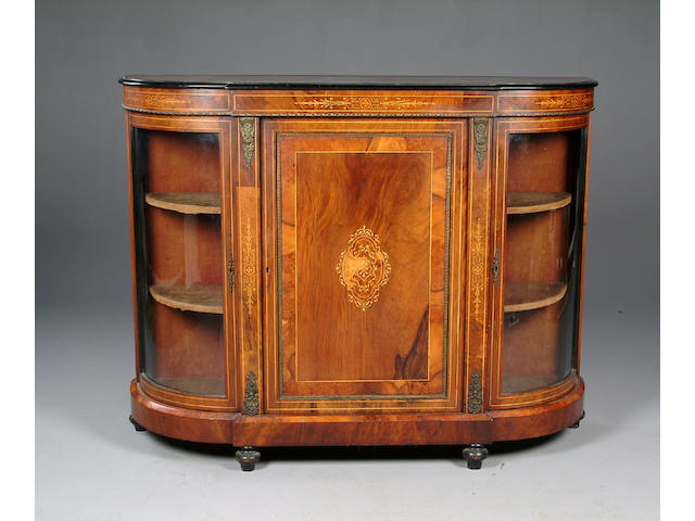 A Victorian walnut gilt metal mounted bowed breakfront credenza,