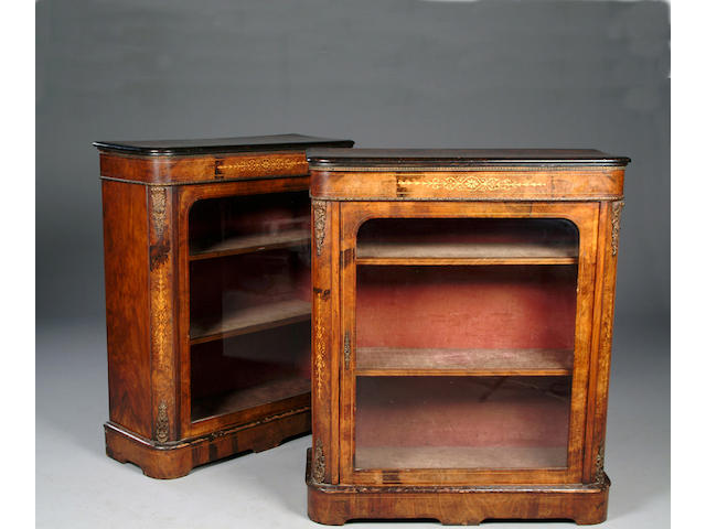 A pair of Victorian gilt metal mounted walnut pier cabinets,