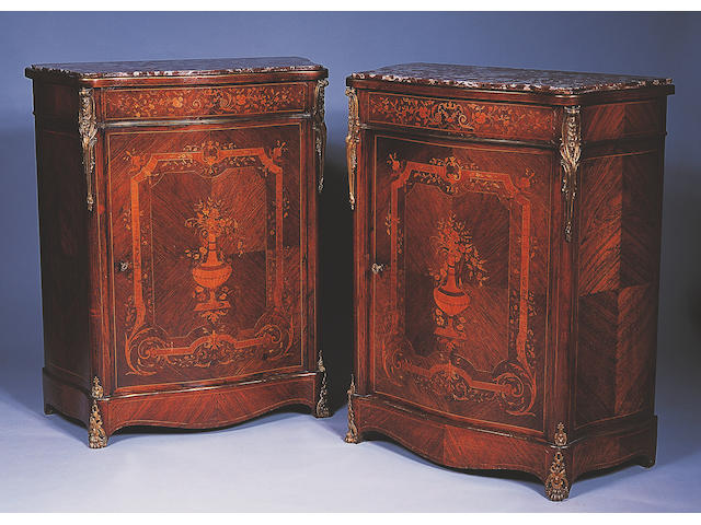 A pair of Louis XVI style rosewood and marquetry petit commodes