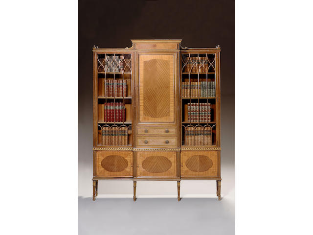 A George III style kingwood, tulipwood and palmwood breakfront cabinet on stand