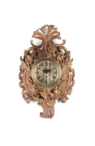 An 18th century carved and gilt wood cartel clock, with later movement Isaac Rogers, London