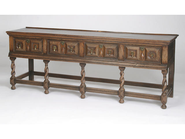 An early 18th Century and later oak low dresser,