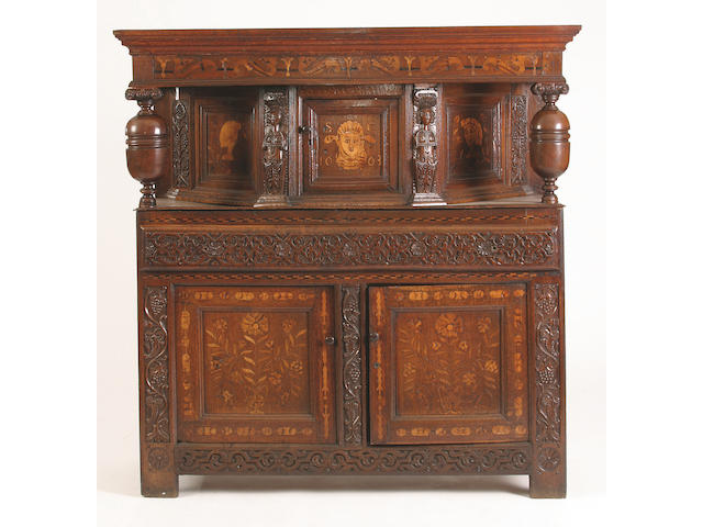 A late 17th Century and later oak and marquetry press cupboard,