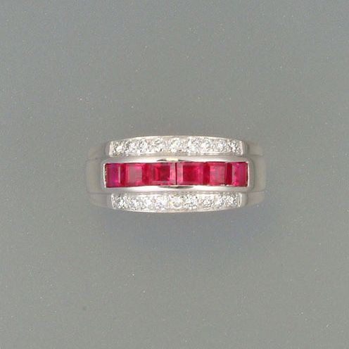 A ruby and diamond half-hoop eternity ring