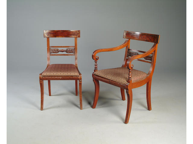 A set of fourteen Scottish Regency style mahogany and brass strung dining chairs