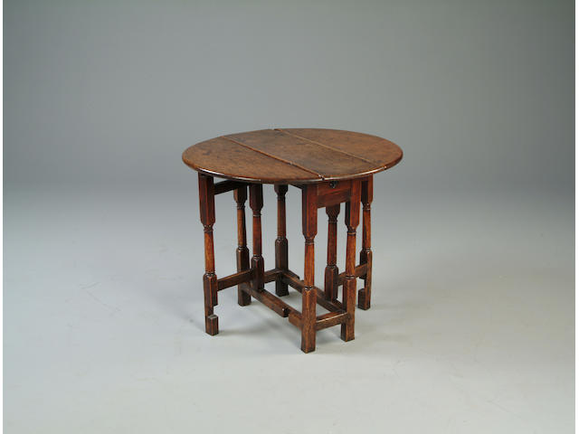 A 17th century oak gateleg table of small proportions
