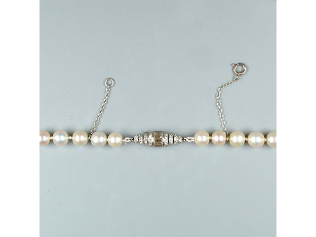 A single-strand natural pearl necklace with an art deco diamond clasp by Janesich
