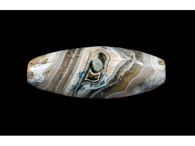 A sizeable Elamite veined agate inscribed lentoid bead,  Kassite, Second half of 14th Century B.C.