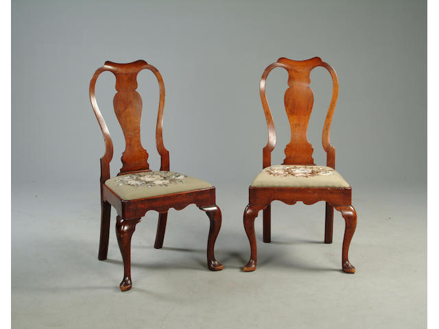 A pair of early 18th Century baluster splat back dining chairs