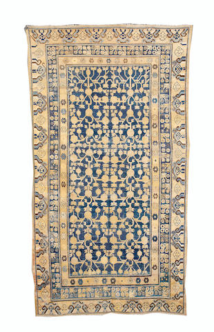 A Khotan rug, East Turkestan, 10 ft 8 in x 5 ft 10 in (325 x 178 cm)