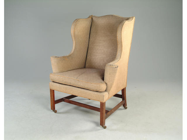 A George III style wing back arm chair