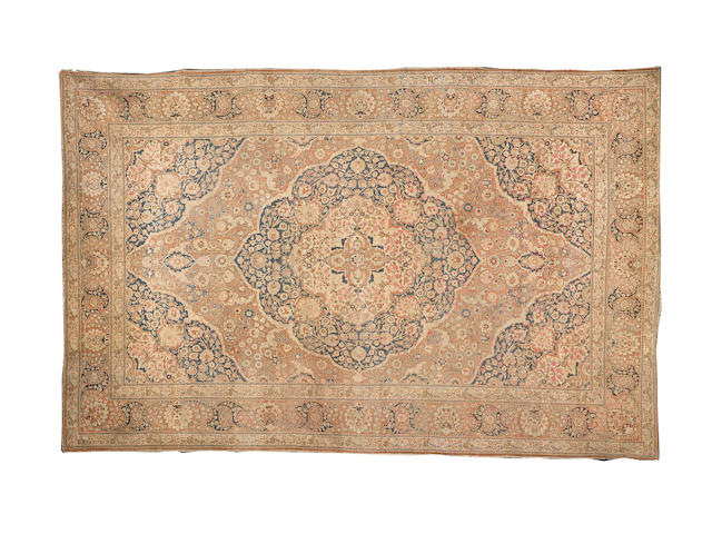 A large Tabriz carpet, North West Persia, 17 ft 3 in x 11 ft (526 x 334 cm)