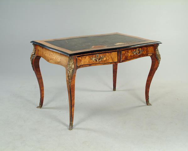 A Louis XVI style walnut, floral marquetry, ebonised and gilt metal mounted bureau plat