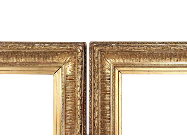 A pair of French 19th Century gilded composition Empire style frames,