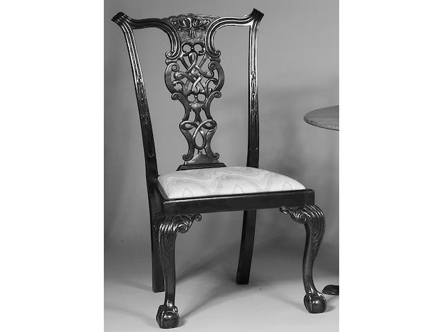 A set of six carved mahogany dining chairs,