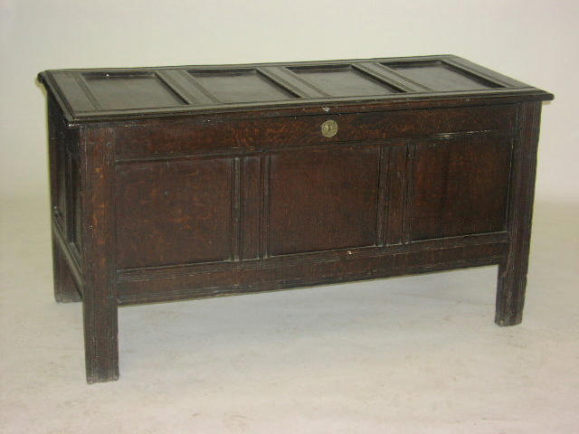 A 17th century carved oak coffer,