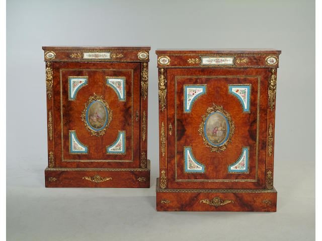 A fine pair of French thuya and porcelain mounted pier cabinets