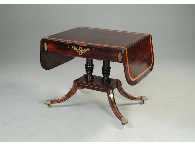 A Regency rosewood, satinwood banded and brass strung sofa table