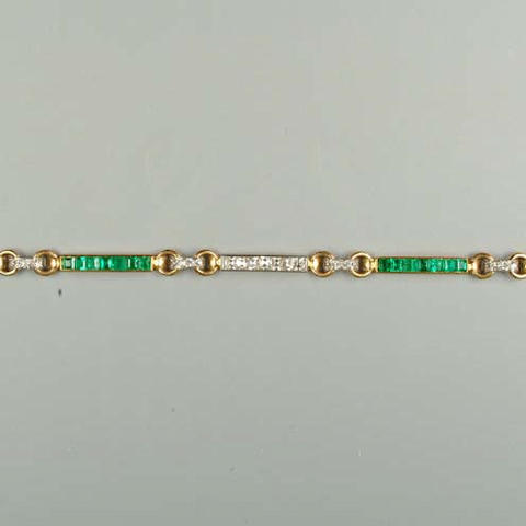 An art deco diamond and emerald line bracelet by Lacloche Fr&#232;res