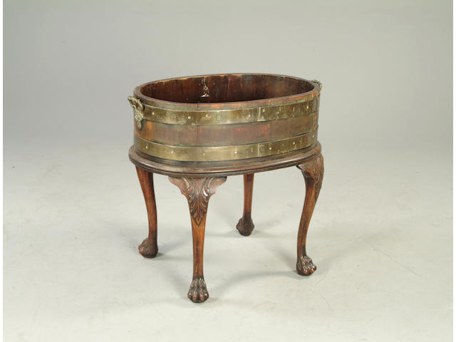 An Irish George III style mahogany and brass bound wine cooler