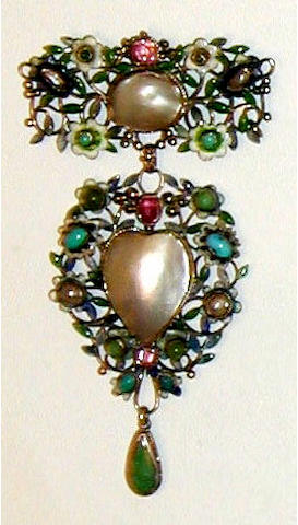 A mother of pearl, enamel and gem set pendant