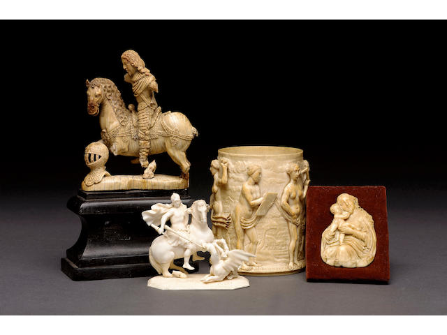 A 17th century German carved ivory equestrian model of a gentleman on horseback