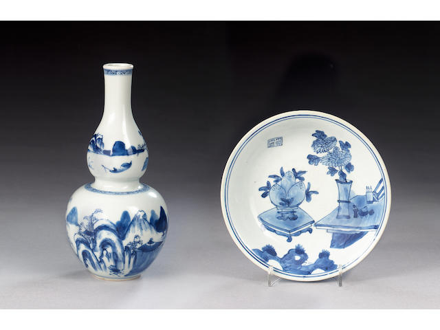 A blue and white bowl and domed cover; together with seven other items of blue and white; and a wood stand [10]