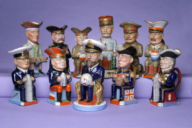 A set of eleven Williamson pottery character jugs,