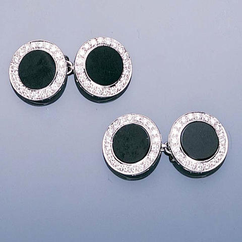A pair of onyx and diamond cufflinks