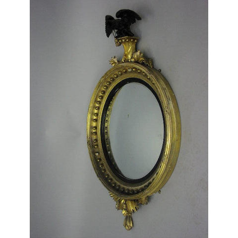 A Regency carved and gilt gesso wall mirror,