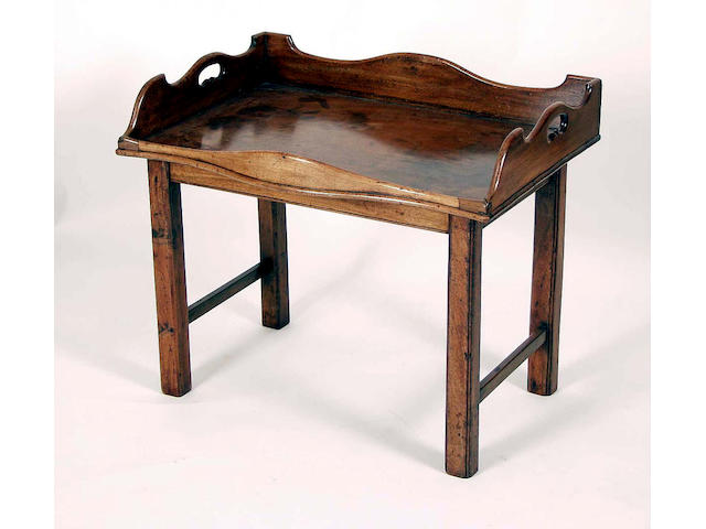 A George III serpentine fronted mahogany butler's tray,