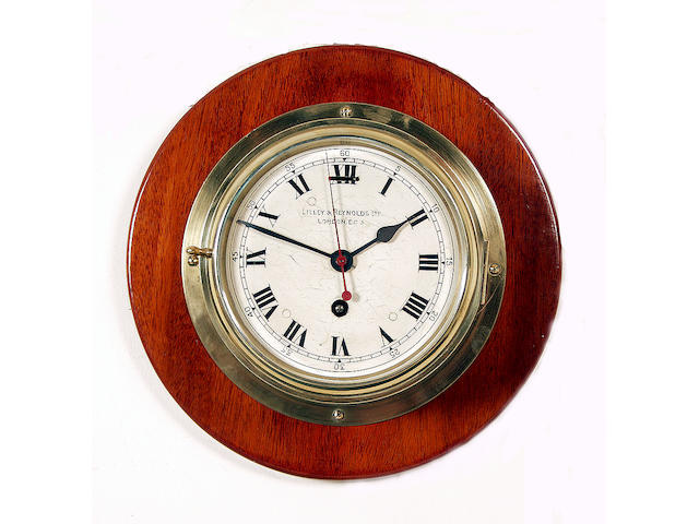 A brass cased Naval style wall clock,