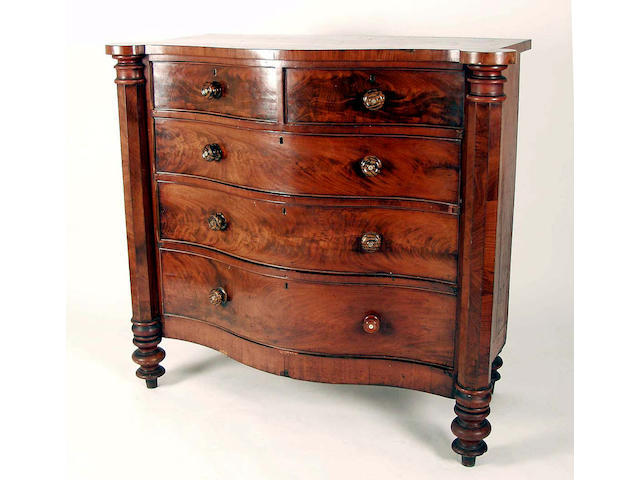 A Victorian mahogany serpentine fronted chest,