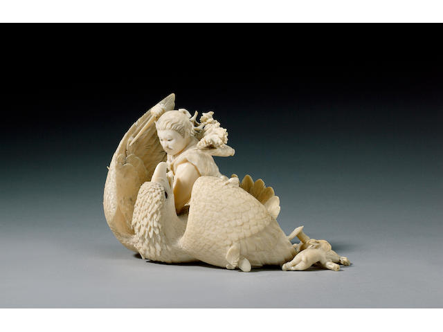 An ivory okimono of a hunter with a bird of prey,