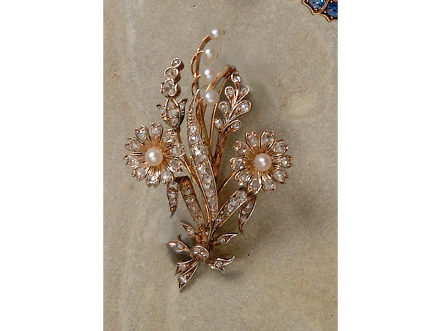 A diamond and pearl floral "en tremblant" spray brooch