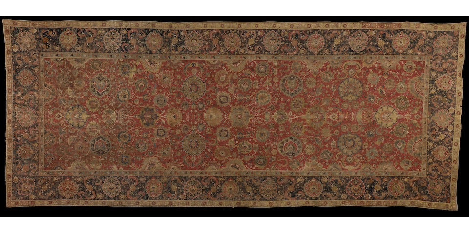 An Isfahan corridor carpet Central Persia, early 17th Century 16 ft 4 in x 6 ft 7 in (497 x 200cm)