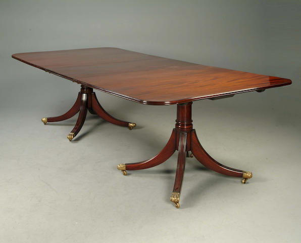 A Regency style mahogany twin pedestal dining table