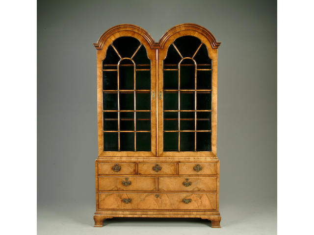 A Queen Anne style walnut double domed display cabinet