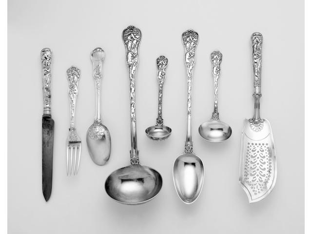 A rare George IV tableservice of Stag Hunt pattern by Paul Storr, 1822, except the George III fish slice, 1816, together with eight additional pieces en suite, George IV/Victorian, by Elizabeth Eaton and others,