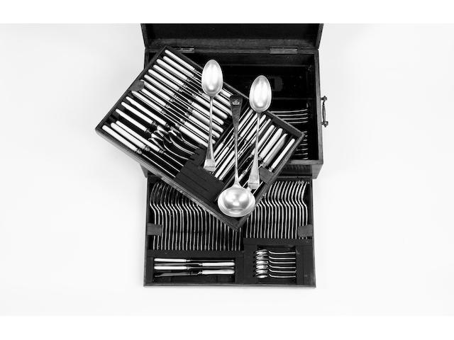 An Edwardian silver Old English pattern table service of flatware, contained in an oak canteen with two lift out draws, by Elkington & Co. Ltd., Birmingham 1900 / 1901,