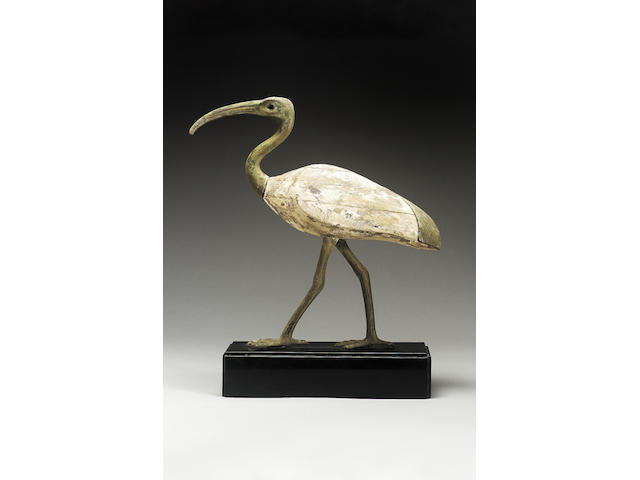 An Egyptian bronze and wood standing Ibis