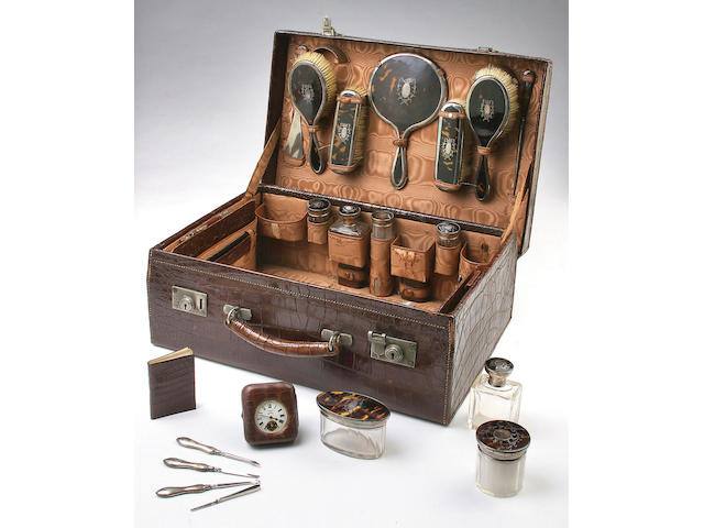 A comprehensive tortoiseshell and silver mounted travelling set, Birmingham 1917,