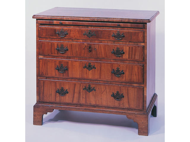 A George II walnut veneered, crossbanded and feather strung chest,