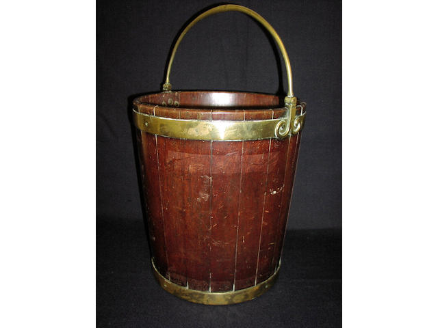 A George III mahogany and brass banded peat bucket