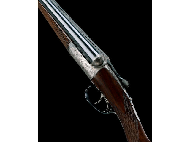 A FINE LIGHTWEIGHT 12-BORE SELF-OPENING ROUND-ACTION EJECTOR GUN BY J. DICKSON, NO. 7110 In its brass-mounted leather case
