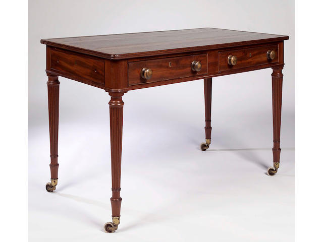 An early 19th century mahogany writing table,
