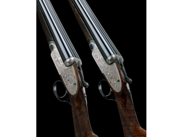 A FINE PAIR OF 12-BORE SINGLE-TRIGGER ASSISTED-OPENING SIDELOCK EJECTOR GUNS BY BOSS, NO. 6633/4 In their leather lightweight motor case